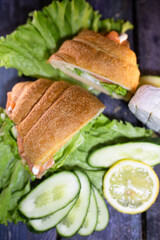 croissant with salmon, lettuce and fresh cucumber