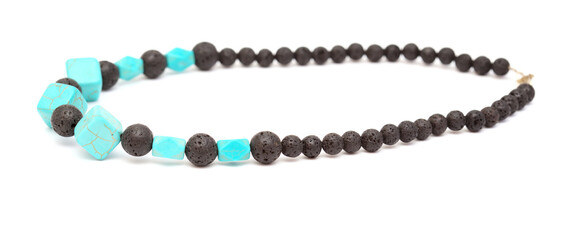 Holiday jewelry - simple necklace made of black porous volcanic beads isolated on white background 