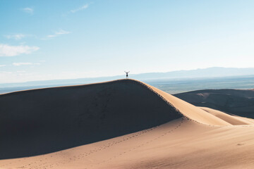 Fototapeta na wymiar Celebration of Summiting a Sand Dune