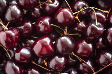 Bunch of ripe cherries in the market close-up. Cherry background