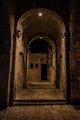 Iconic empty alleyway at night somewhere in the center of Bari, Italy