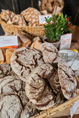 a counter in a bakery with a variety products on the table
