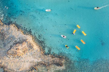 Aerial drone photograph watersports at fig tree bay beach cyprus