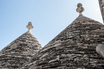 Fototapeta na wymiar Typical pilled stone roof of a trullo in Alberobello, Southern Italy