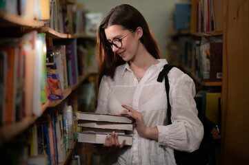 Portrait of a student girl studying at library