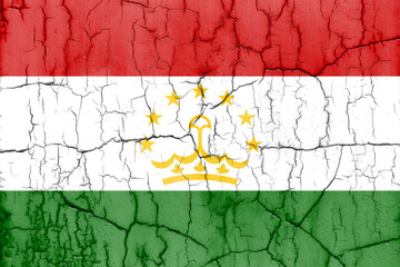Textured photo of the flag of Tajikistan with cracks.