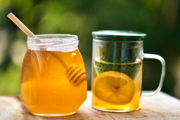 cup of tea with lemon and honey in jar