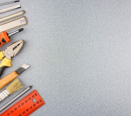 Background with repair tools set.Different locksmith tools for home repair with place for...
