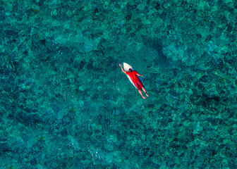 Aerial view of surfer in Indian Ocean. Maldives