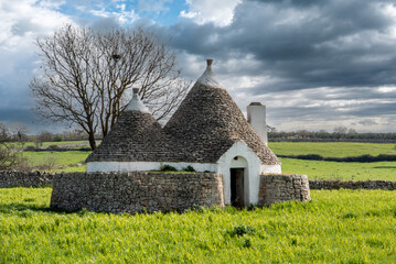 Scenic Trullo dwelling in the rural landscape near Alberobello, Italy