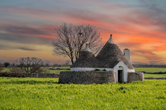 Scenic Trullo dwelling in the rural landscape near Alberobello, Italy