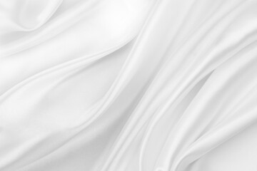 Obraz na płótnie Canvas Close-up of rippled white silk fabric texture background 