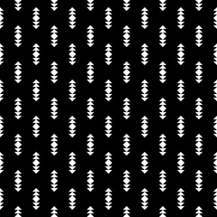 Repeated white figures on black background. Ethnic wallpaper. Seamless surface pattern design with arrows ornament. Rhombuses and triangles motif. Digital paper for textile print, web designing.