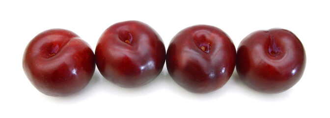 Ripe plums on a white background.
