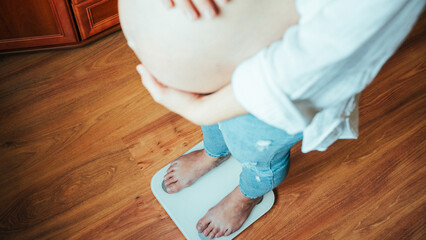 Pregnant scale gain weight. Happy pregnancy woman standing on weight scales. Concept maternity,...