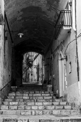 An empty staircase leading through a passage, somewhere in downtown Matera, Italy