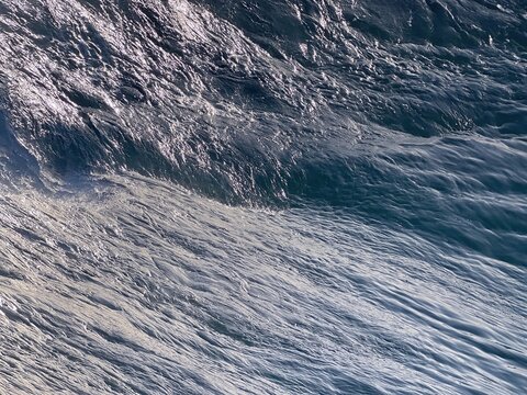Shiny waves of the sea background.