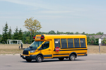 Yellow school bus at the school parking
