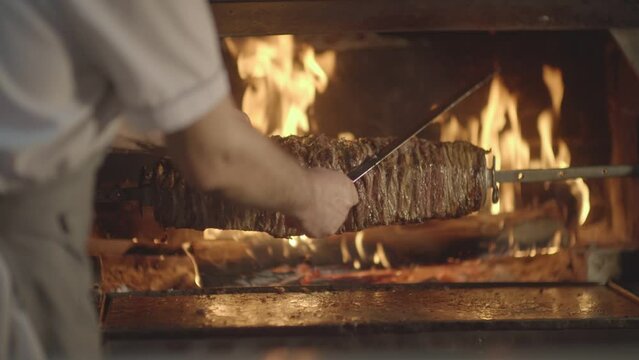 Details of the master and delicious kebab making Turkish kebab by the hearth