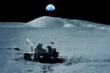 Astronaut on the moon, near the moon rover. Elements of this image furnished by NASA