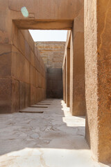 Beige stone walls of corridor near the Great Pyramid of Giza, Egypt. Architectural landmark in Africa.