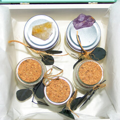 scented candles in glass jar with decorative elements