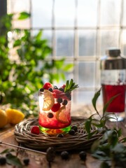 fruit cocktail with ice in the backlight. fruit and berry cocktail.