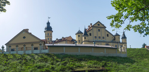 Fototapeta premium Public place of Nesvizh Castle, Belarus. Medieval castle and palace. Restored medieval fortress. Heritage concepts.