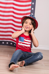 child wearing 4th of july clothes and hat celebrating studio photo copy space 
