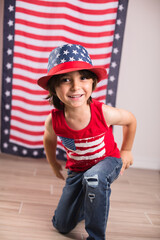 child wearing 4th of july clothes and hat celebrating studio photo copy space 