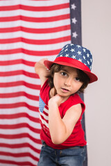 child wearing 4th of july clothes and hat celebrating studio photo copy space 