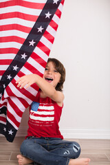 child wearing 4th of july clothes and hat celebrating studio photo copy space 