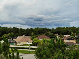 Fototapeta na wymiar Tampa, FL USA - 06 20:2022: House and thunder storm cloud