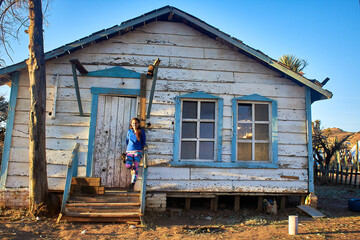  old build with girl tourist in front of the house with old west style in old west durango 