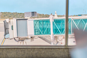 Jetway waiting for a plane to arrive on airport.airport terminal boarding gate. Travel Concept.