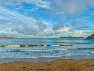 Aerial sunset at the seaside with rain clouds