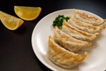 Freshly baked dumplings with plenty of gravy on the table