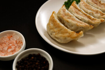 Freshly baked dumplings with plenty of gravy on the table