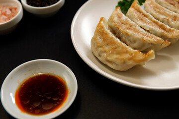 Freshly baked dumplings with plenty of gravy on the table
