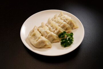 Freshly baked dumplings with plenty of gravy on the table