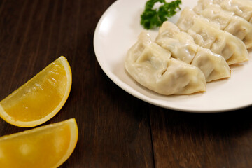 Freshly baked dumplings with plenty of gravy on the table