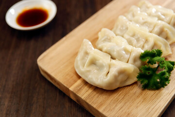 Freshly baked dumplings with plenty of gravy on the table