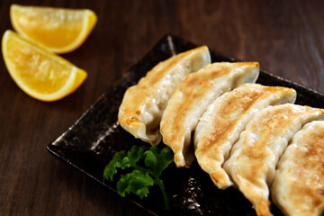 Freshly baked dumplings with plenty of gravy on the table