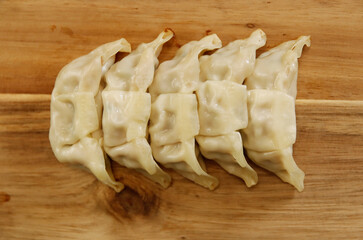 Freshly baked dumplings with plenty of gravy on the table