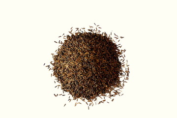 heap of organic indian aromatic spice black cumin or kali jiri seeds,different name in various states in india,white background,top view   
