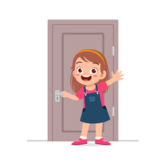 little kid standing and holding door knob
