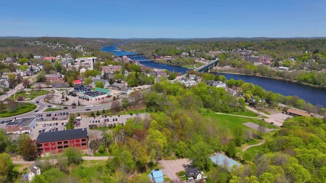 Kennebec River in spring aerial view near historic downtown of Augusta, Maine ME, USA. 