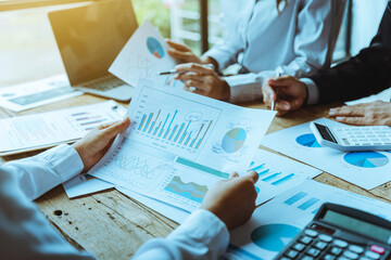 Three business people meeting and consulting financial and tax at office desk.