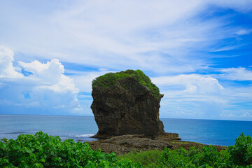 Chuanfan Rock,  a large piece of coral rock that broke off the mainland. Taiwan's southernmost point and one of the peninsula's most notable landmarks. Pingtung County, Taiwan. © twabian