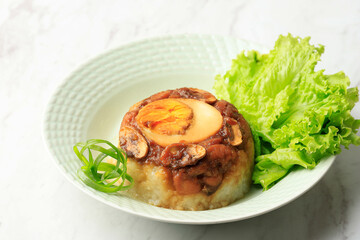 Homemade Nasi Tim Ayam, Steamed Rice with Diced Chicken Soy Sauce and Half Boiled Egg.